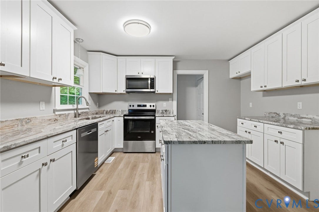 10731 Spring Run Road, Manchester, Chesterfield, VA 23832 White shaker-style cabinetry with brushed nickel hardware, stone-finish countertops, stainless steel appliances, center island, and wood-finish flooring