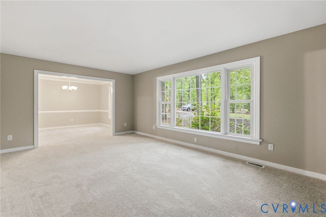 10731 Spring Run Road, Manchester, Chesterfield, VA 23832 Expansive room with neutral carpeting and a wide window featuring multiple panes