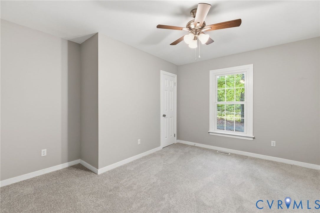 10731 Spring Run Road, Manchester, Chesterfield, VA 23832 Neutral-toned carpeting, white trim, and a ceiling fan with integrated lighting