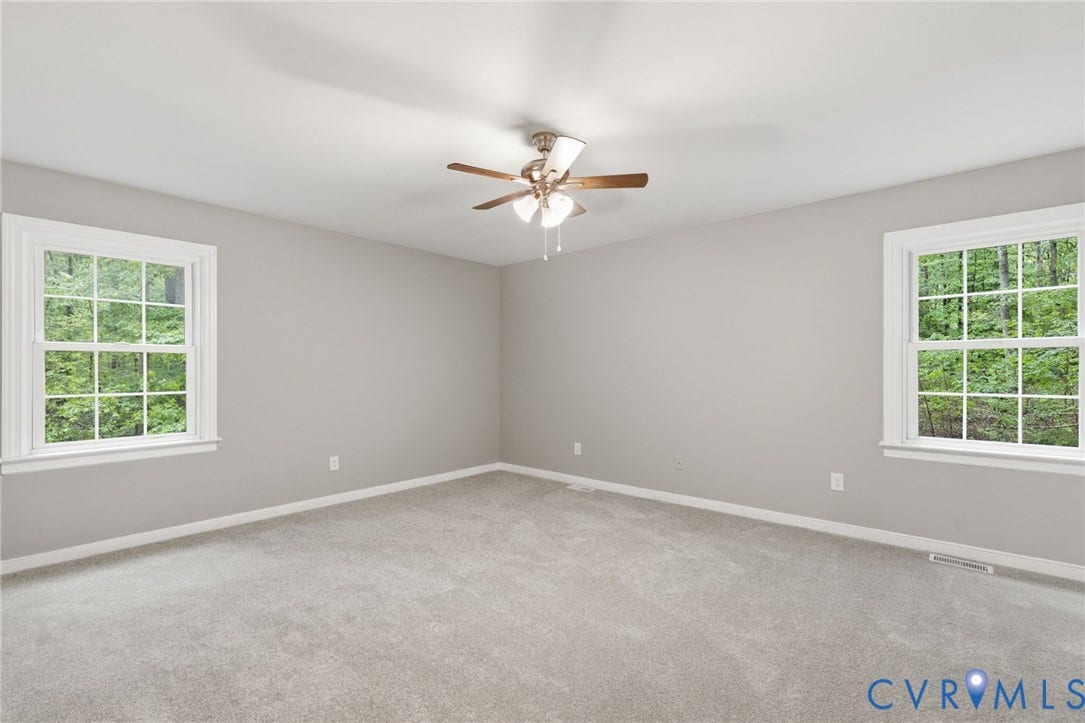 10731 Spring Run Road, Manchester, Chesterfield, VA 23832 Recessed ceiling with a flush-mount ceiling fan, two double-hung windows, and light gray wall-to-wall carpeting