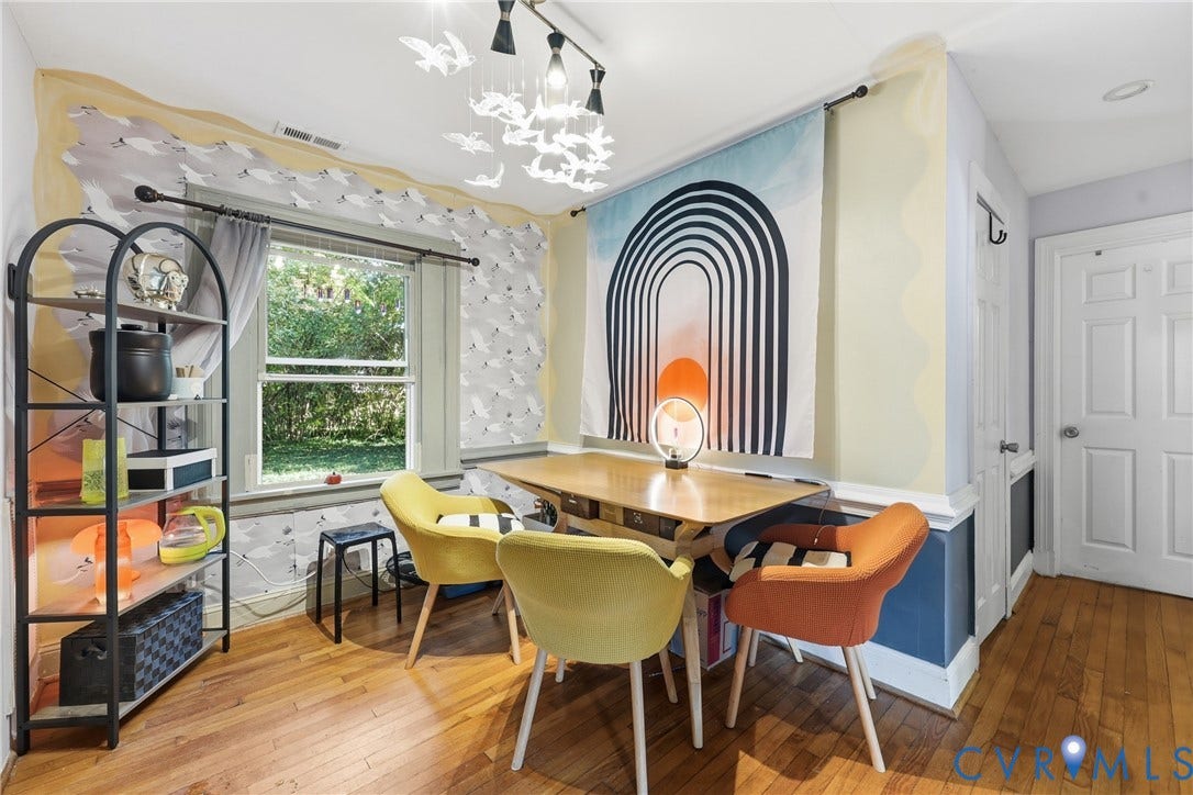 Hardwood-finish flooring, built-in shelving, and a multi-panel door