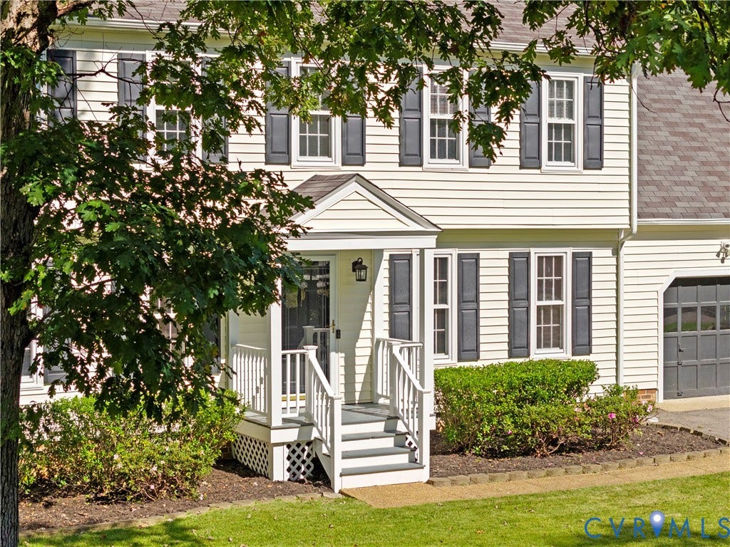 2307 Garrison Place Terrace, Garrison Place, Midlothian, VA 23112 Two-story vinyl siding exterior featuring louvered shutters, a covered front porch with white railing, and an attached garage