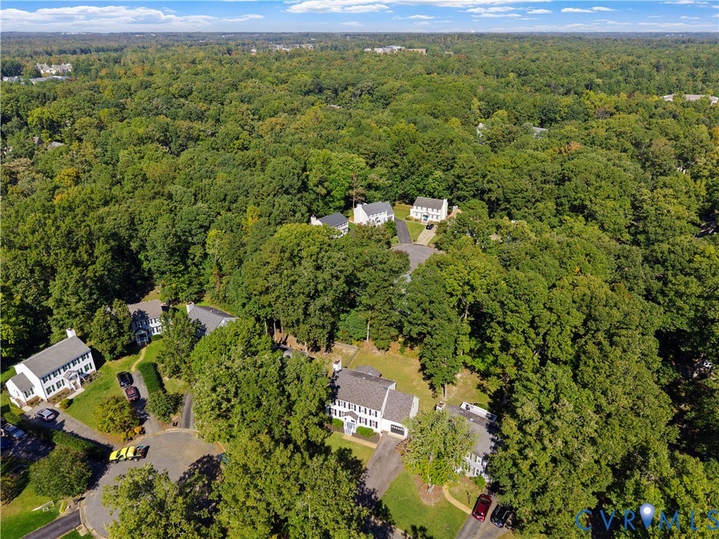 2307 Garrison Place Terrace, Garrison Place, Midlothian, VA 23112 Aerial perspective of a multi-structure residential area featuring mature woodland canopy, cul-de-sac street layout, and paved driveways