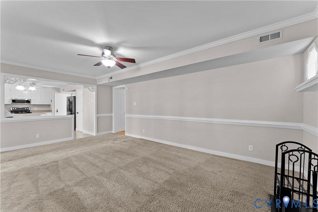2307 Garrison Place Terrace, Garrison Place, Midlothian, VA 23112 Neutral wall tones accented by chair rail molding, ceiling fan with integrated lighting, and carpeted flooring
