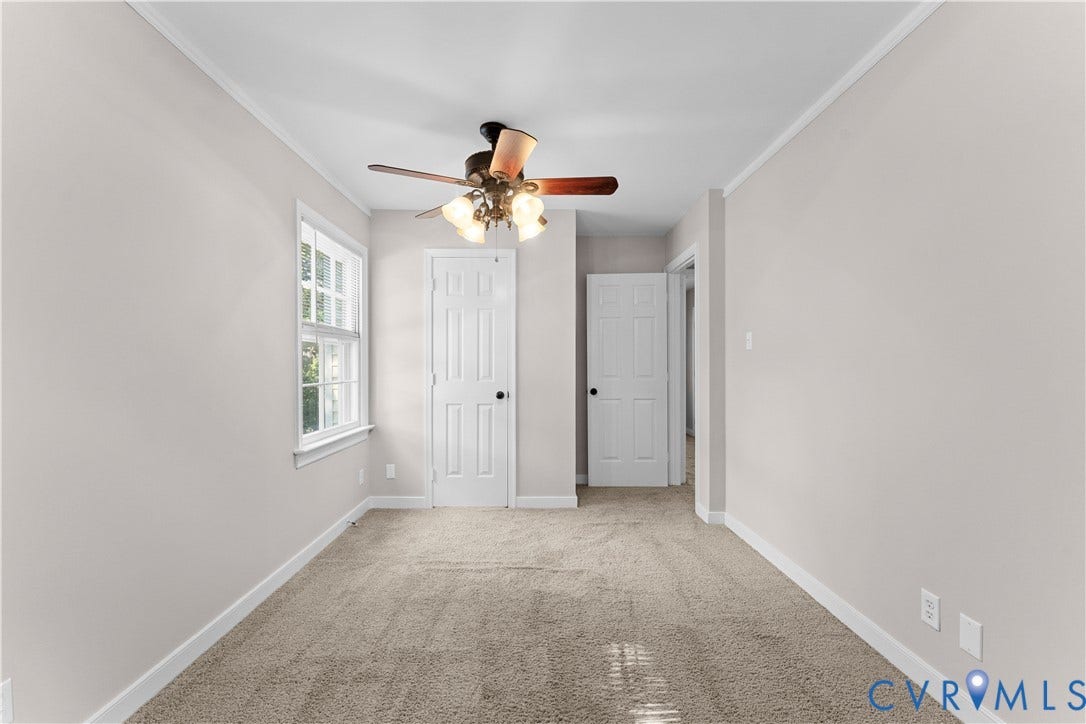 2307 Garrison Place Terrace, Garrison Place, Midlothian, VA 23112 Interior space featuring neutral wall tones, wall-to-wall carpeting, a multi-pane window, and a ceiling fan with integrated lighting fixtures