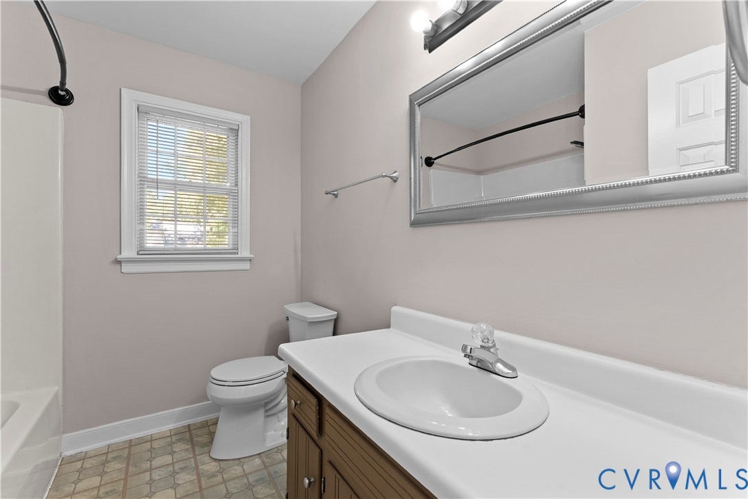 2307 Garrison Place Terrace, Garrison Place, Midlothian, VA 23112 Bathroom featuring a vanity with an integrated countertop and basin, framed wall-mounted mirror, multi-light fixture, and tub-shower combination