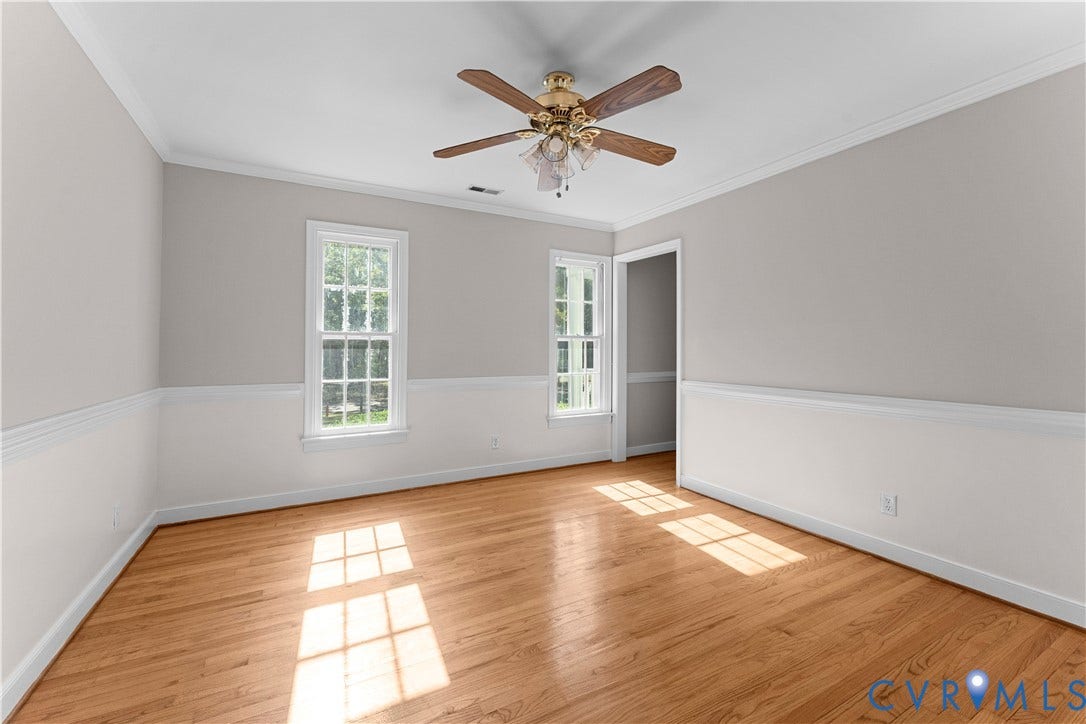 2307 Garrison Place Terrace, Garrison Place, Midlothian, VA 23112 Room featuring wood-finish flooring, chair rail molding, crown molding, double-hung windows, and a central ceiling fan with integrated light fixtures