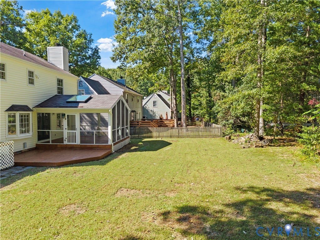 2307 Garrison Place Terrace, Garrison Place, Midlothian, VA 23112 Screened porch with a skylight, wood-finish decking, and a fenced backyard featuring mature trees