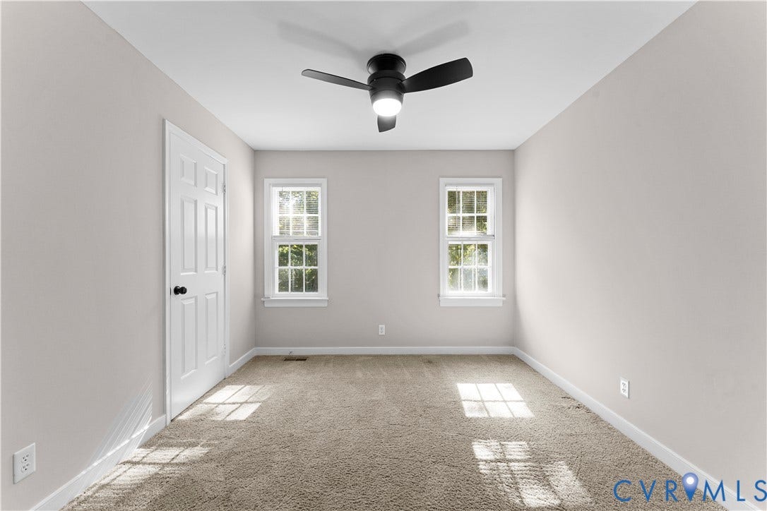 2307 Garrison Place Terrace, Garrison Place, Midlothian, VA 23112 Room featuring neutral wall tones, wall-to-wall carpeting, two double-hung windows, and a matte black ceiling fan with an integrated light fixture