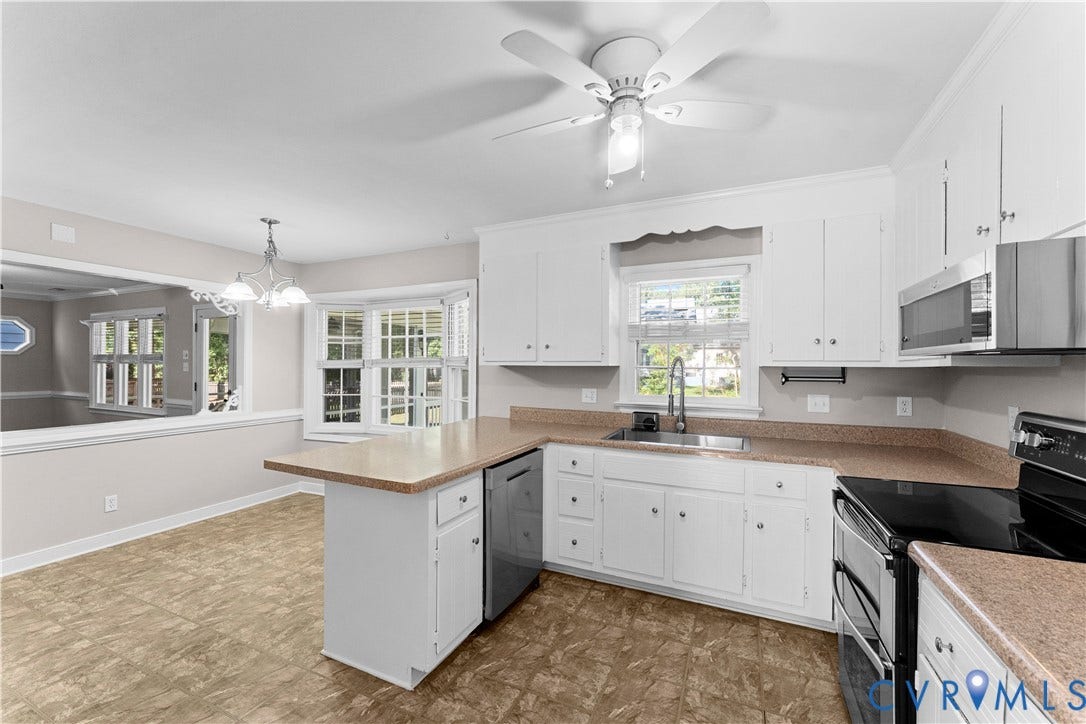 2307 Garrison Place Terrace, Garrison Place, Midlothian, VA 23112 Kitchen featuring white cabinetry, solid surface countertops, stainless steel appliances, a peninsula, and a ceiling fan