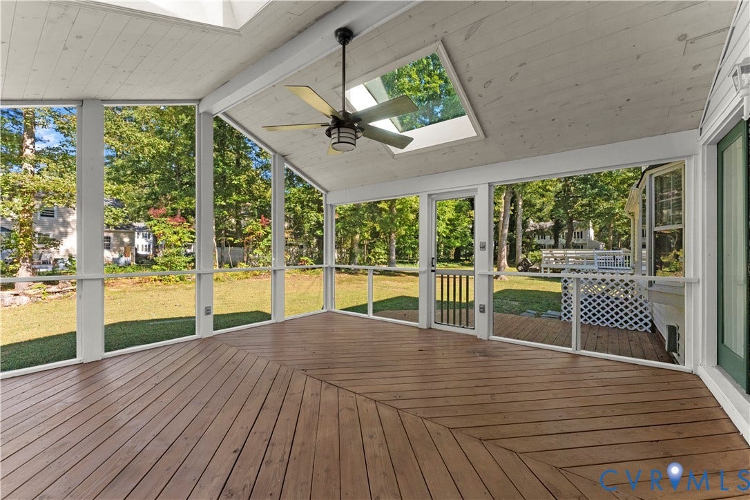 2307 Garrison Place Terrace, Garrison Place, Midlothian, VA 23112 Screened-in porch featuring wood-plank decking, a vaulted wood-paneled ceiling, integrated skylights, and a ceiling fan