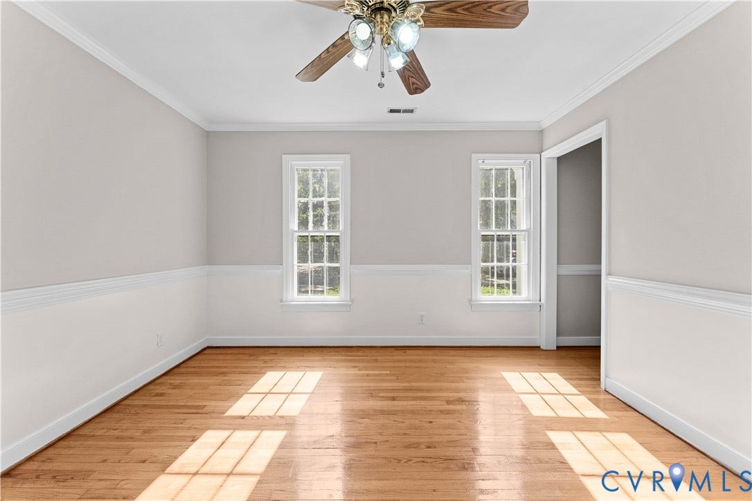 2307 Garrison Place Terrace, Garrison Place, Midlothian, VA 23112 Interior space featuring wood-finish flooring, two-tone wall paint, white chair rail molding, crown molding, and a ceiling fan with integrated lighting