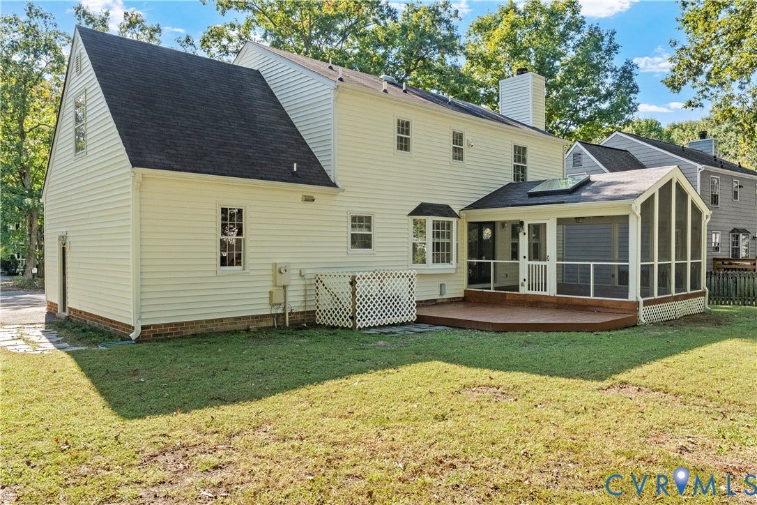 2307 Garrison Place Terrace, Garrison Place, Midlothian, VA 23112 Exterior featuring light-colored horizontal siding, a screened-in porch with a skylight, an attached wooden deck, a bay window, and a chimney
