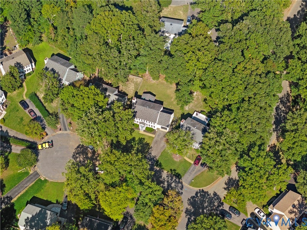2307 Garrison Place Terrace, Garrison Place, Midlothian, VA 23112 Aerial perspective of a multi-story residence featuring a shingled roof, asphalt driveway, and expansive parcel surrounded by mature trees