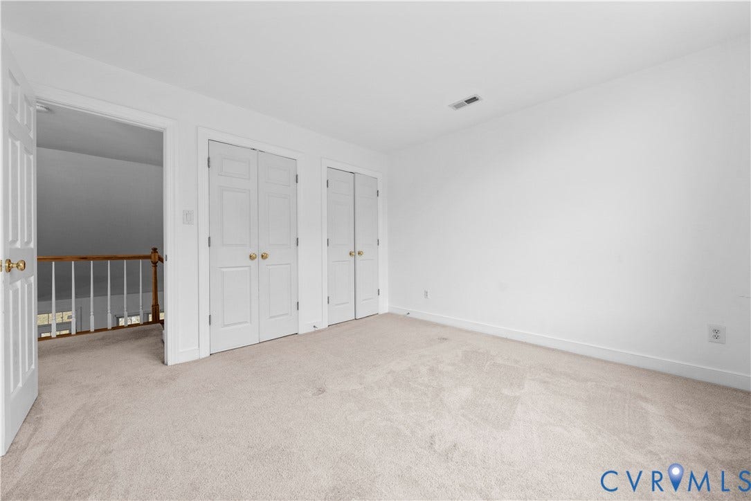 3437 Riverton Court, Robious Road Corridor, Midlothian, VA 23113 Neutral-toned carpeting, two sets of white paneled closet doors with brass-finish hardware, and a wooden balustrade