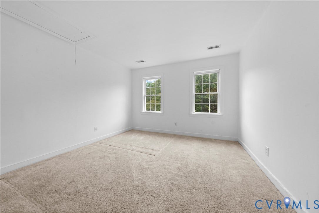 3437 Riverton Court, Robious Road Corridor, Midlothian, VA 23113 Neutral interior space featuring wall-to-wall carpeting, two multi-pane windows, and an integrated ceiling access panel