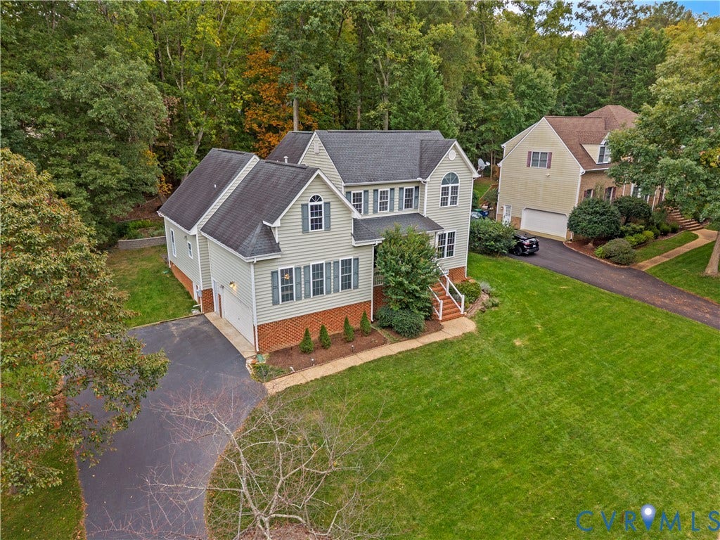 3437 Riverton Court, Robious Road Corridor, Midlothian, VA 23113 Multi-level residence featuring a brick and vinyl siding exterior, asphalt shingle roof, expansive manicured lawn, and attached garage