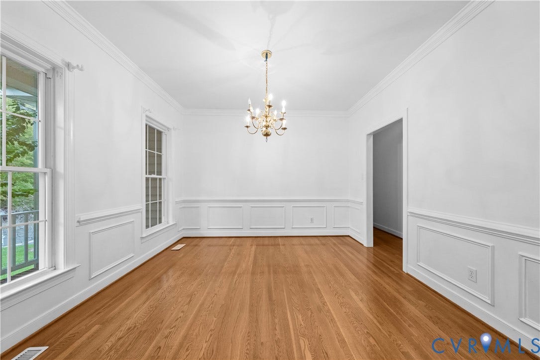 3437 Riverton Court, Robious Road Corridor, Midlothian, VA 23113 Interior space featuring wood-finish flooring, decorative wall wainscoting, multi-pane windows, crown molding, and a central tiered chandelier