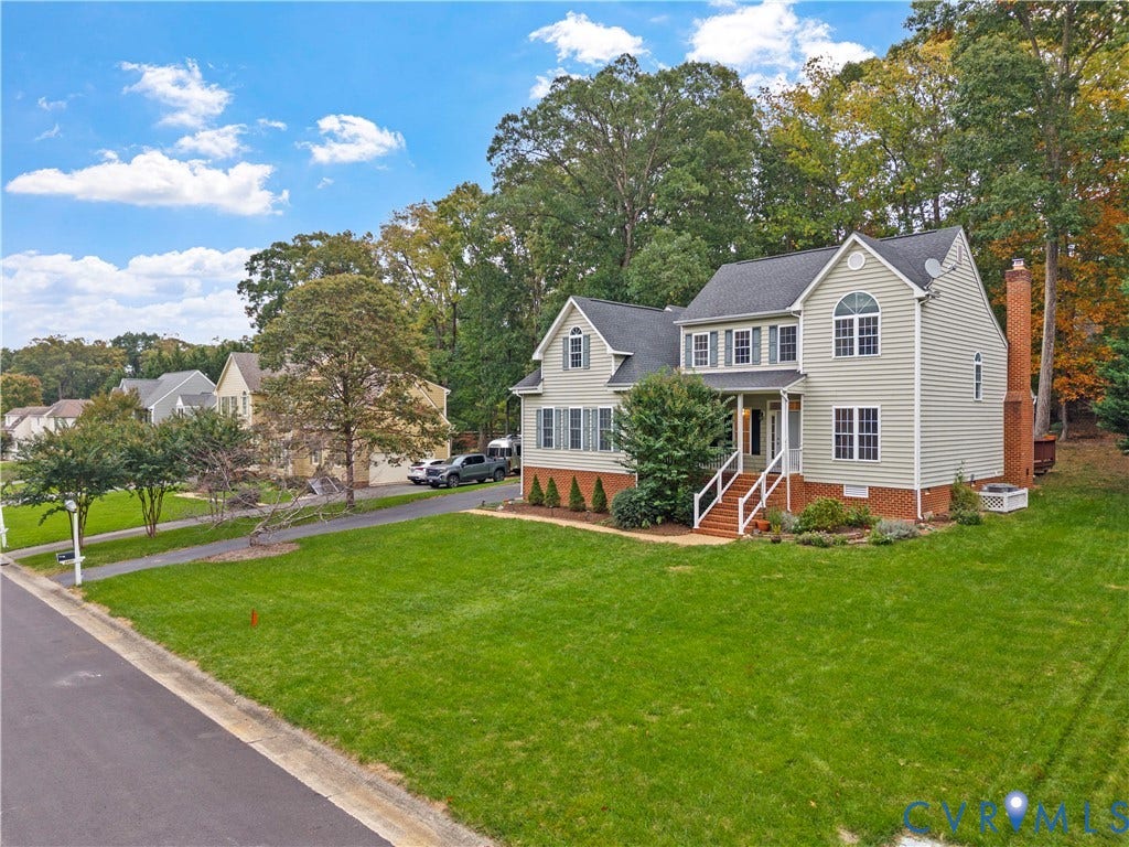 3437 Riverton Court, Robious Road Corridor, Midlothian, VA 23113 Two-story colonial exterior featuring vinyl siding, a brick facade base, an attached brick chimney, a covered front entryway with stairs, and an asphalt driveway