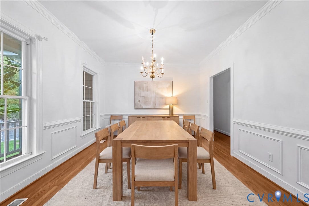 3437 Riverton Court, Robious Road Corridor, Midlothian, VA 23113 Formal dining space featuring hardwood flooring, extensive picture-frame wainscoting, crown molding, and a tiered metal chandelier