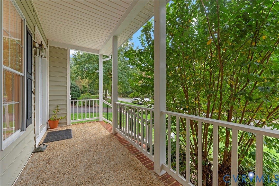 3437 Riverton Court, Robious Road Corridor, Midlothian, VA 23113 Covered front porch featuring white railings, horizontal lap siding, a textured aggregate floor, and brick border detailing