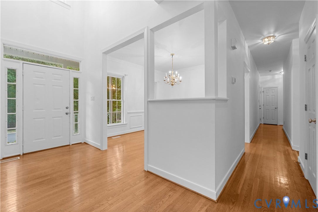 3437 Riverton Court, Robious Road Corridor, Midlothian, VA 23113 Foyer featuring a vaulted ceiling, wood-finish flooring, half-wall architectural divider, decorative chandelier, and an entryway door with sidelights and transom window