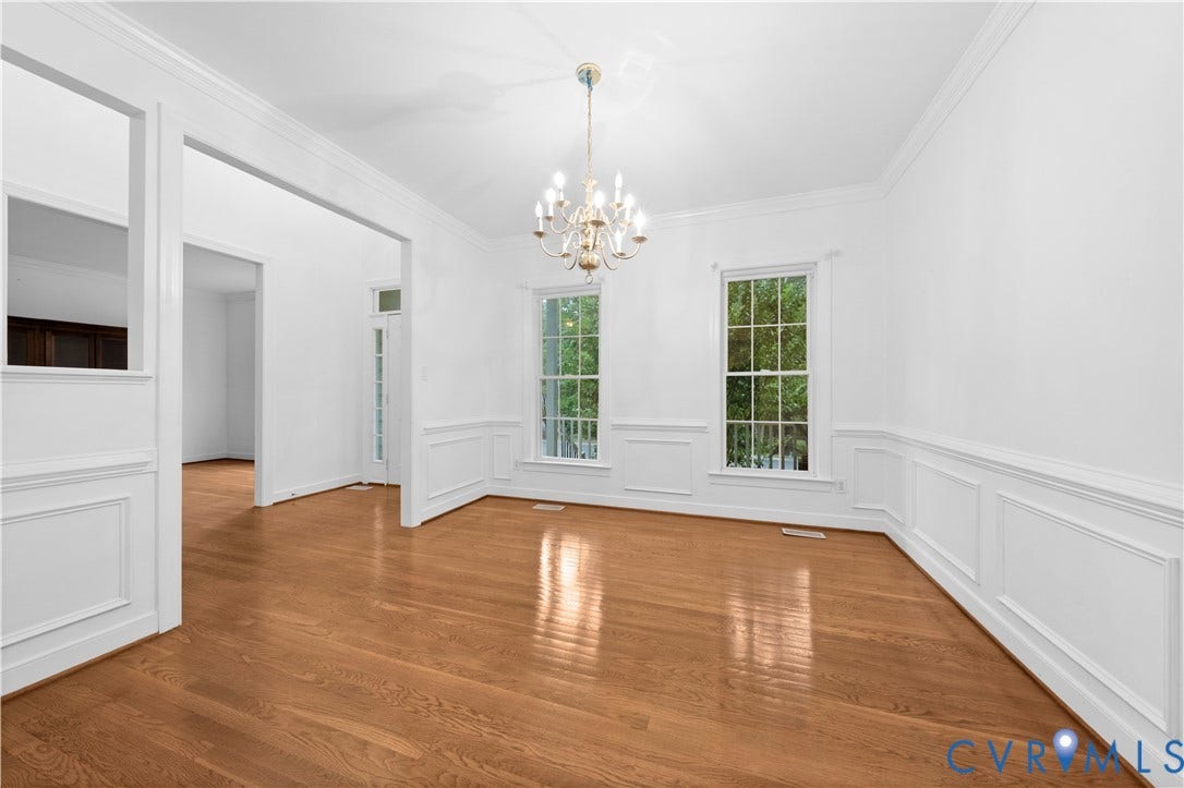 3437 Riverton Court, Robious Road Corridor, Midlothian, VA 23113 Spacious interior featuring wood-finish flooring, decorative wainscoting, crown molding, double-hung windows, and a multi-arm chandelier