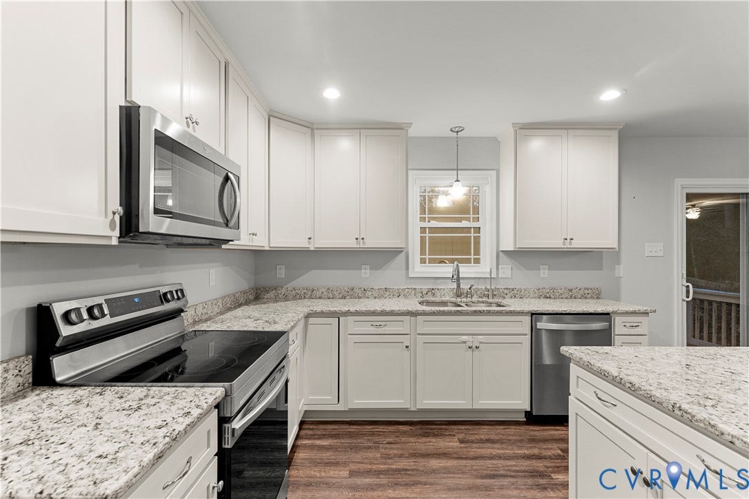 2953 Preston Park Court, Western Goochland County, Goochland, VA 23153 White cabinetry, stainless steel appliances, speckled countertops, wood-finish flooring, and recessed lighting