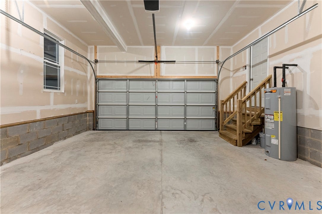 2953 Preston Park Court, Western Goochland County, Goochland, VA 23153 Concrete flooring, single overhead garage door, interior window, natural wood staircase, and water heater