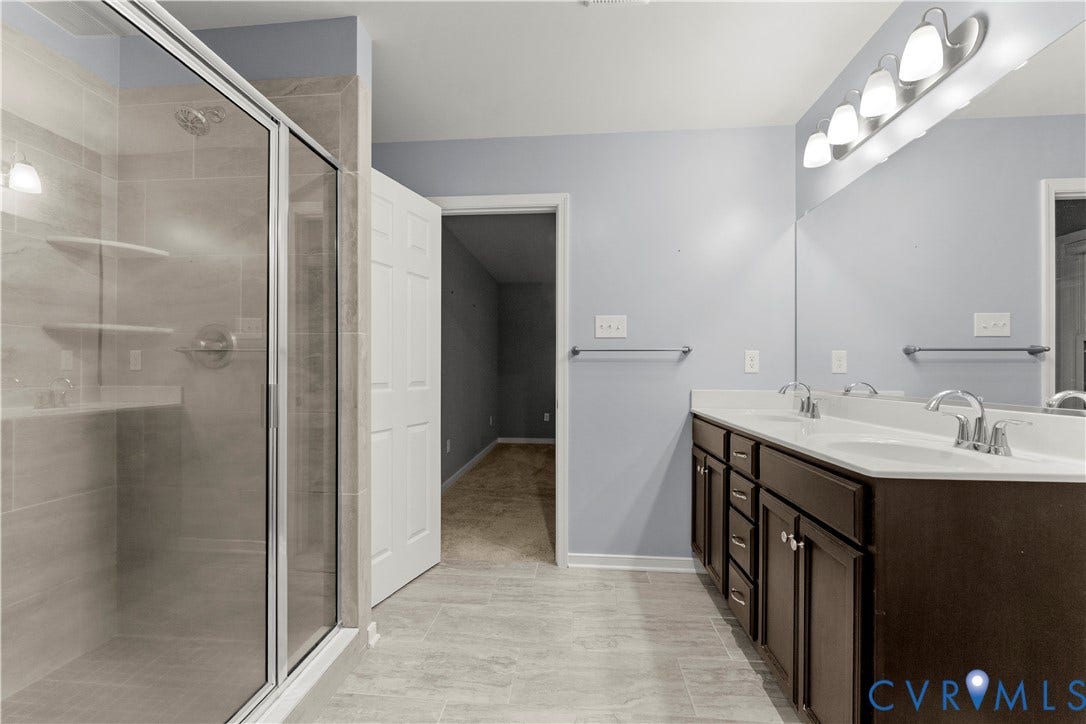 2953 Preston Park Court, Western Goochland County, Goochland, VA 23153 Walk-in shower with clear glass enclosure, dual vanity with undermount sinks, and tiled flooring