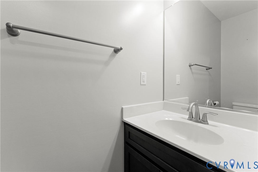 2953 Preston Park Court, Western Goochland County, Goochland, VA 23153 Vanity with a single basin sink, brushed nickel faucet, and a large mirror