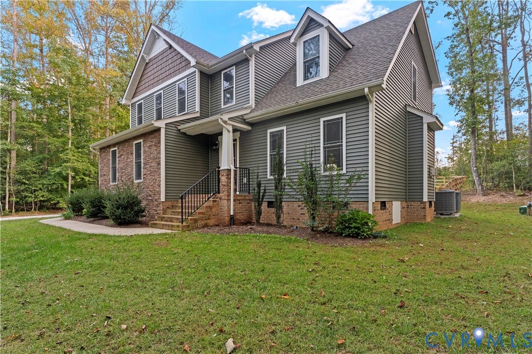 2953 Preston Park Court, Western Goochland County, Goochland, VA 23153 Two-story residence featuring siding and brick facade, an asphalt shingle roof, and multiple dormer windows