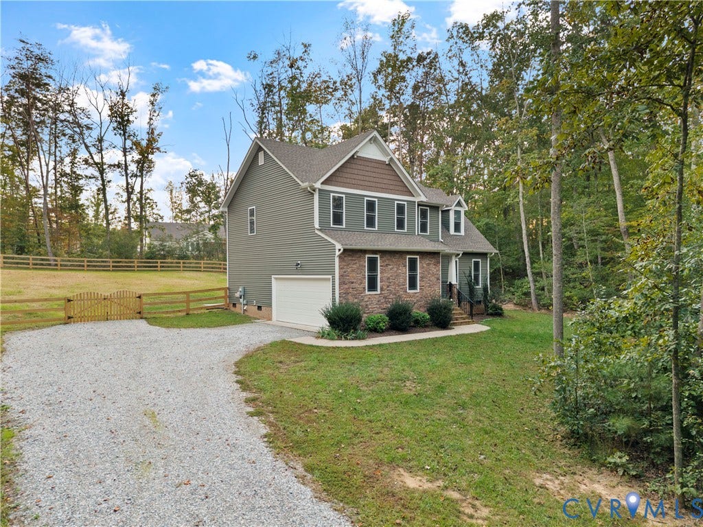 2953 Preston Park Court, Western Goochland County, Goochland, VA 23153 Two-story exterior with siding and brick accents, an attached garage, and a gravel driveway