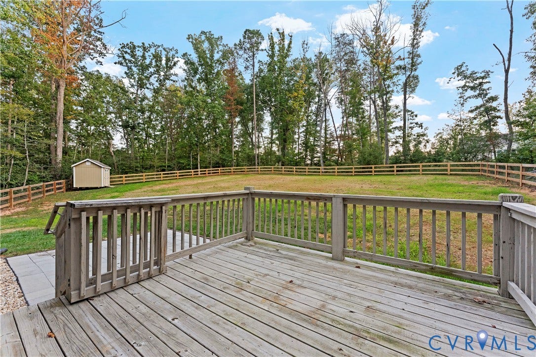 2953 Preston Park Court, Western Goochland County, Goochland, VA 23153 Charming storage shed featuring a peaked roof with architectural shingles, white trim detailing, and a functional double-door entrance with six-panel design