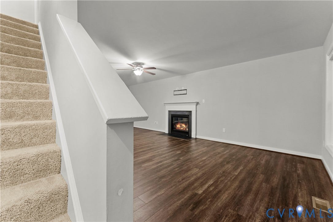 2953 Preston Park Court, Western Goochland County, Goochland, VA 23153 Wood-finish flooring, a fireplace with a white mantel, and a ceiling fan