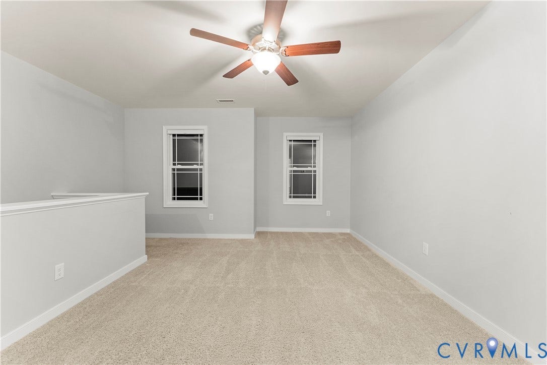 2953 Preston Park Court, Western Goochland County, Goochland, VA 23153 Open loft area featuring neutral carpeting, a ceiling fan with light, and multiple windows with white trim