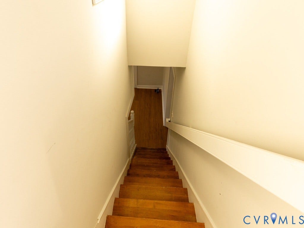 2201 Richmond Street, Hopewell, VA 23860 Wood-finish stairs with white risers and a white painted handrail