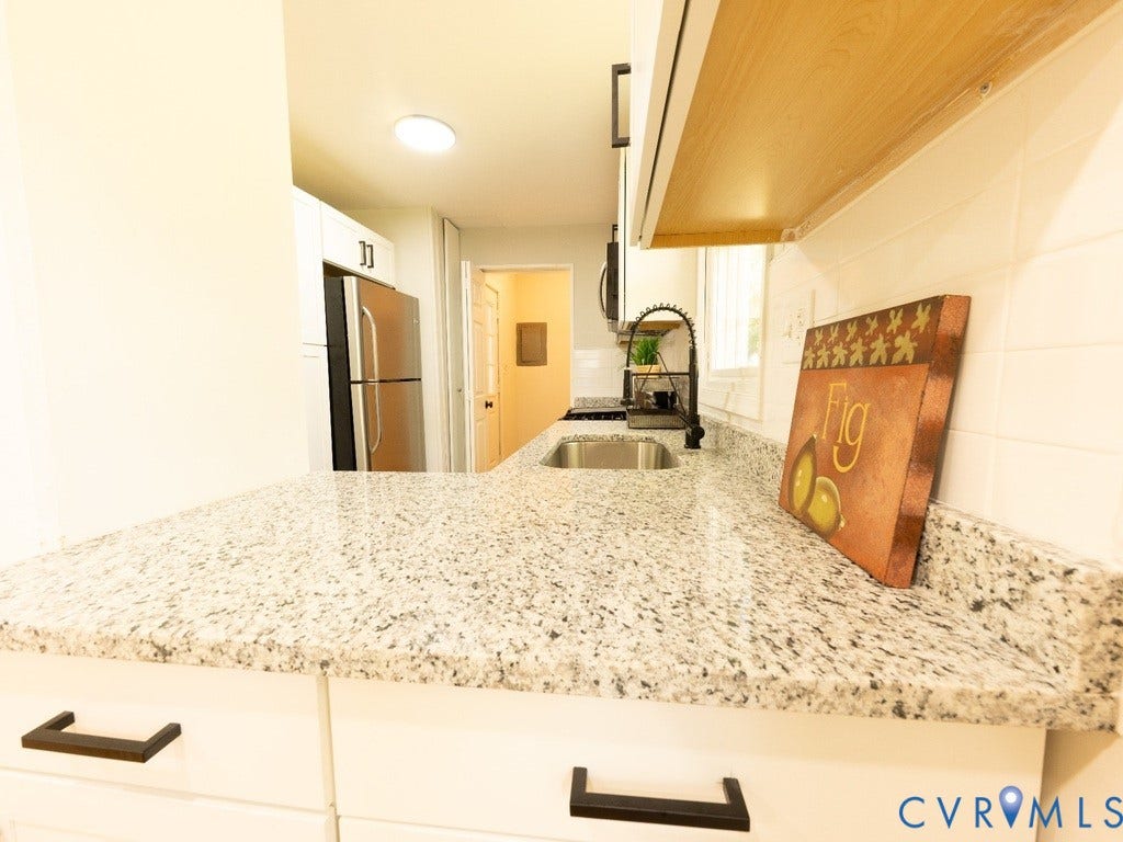 2201 Richmond Street, Hopewell, VA 23860 Galley kitchen featuring speckled quartz countertops, stainless steel appliances, and recessed lighting
