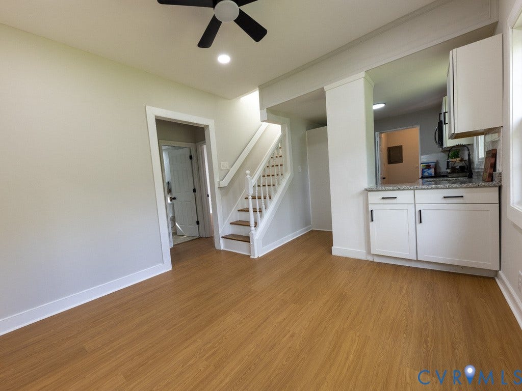 2201 Richmond Street, Hopewell, VA 23860 Wood-finish flooring throughout, white painted walls, white trim, recessed lighting, and a ceiling fan