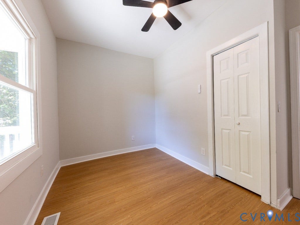 2201 Richmond Street, Hopewell, VA 23860 Recessed ceiling fan with integrated lighting, wood-finish flooring, and white trim throughout