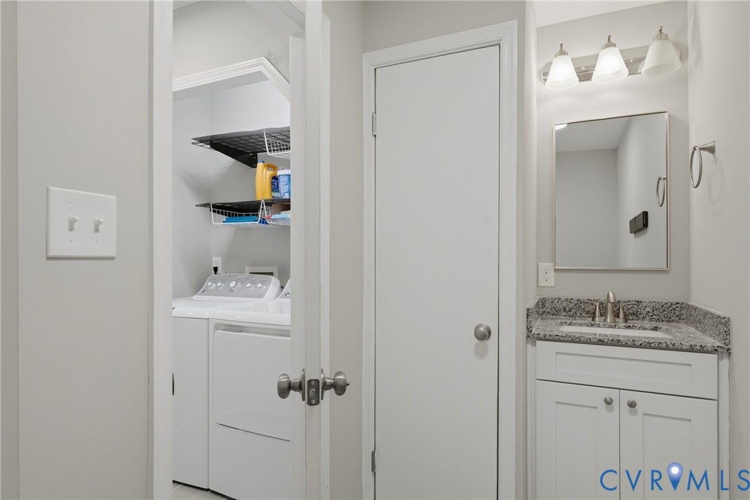 6624 Miller Road, Henrico, VA 23231 2nd full bath on 1st floor. Vanity with a granite countertop, undermount sink, and brushed nickel faucet