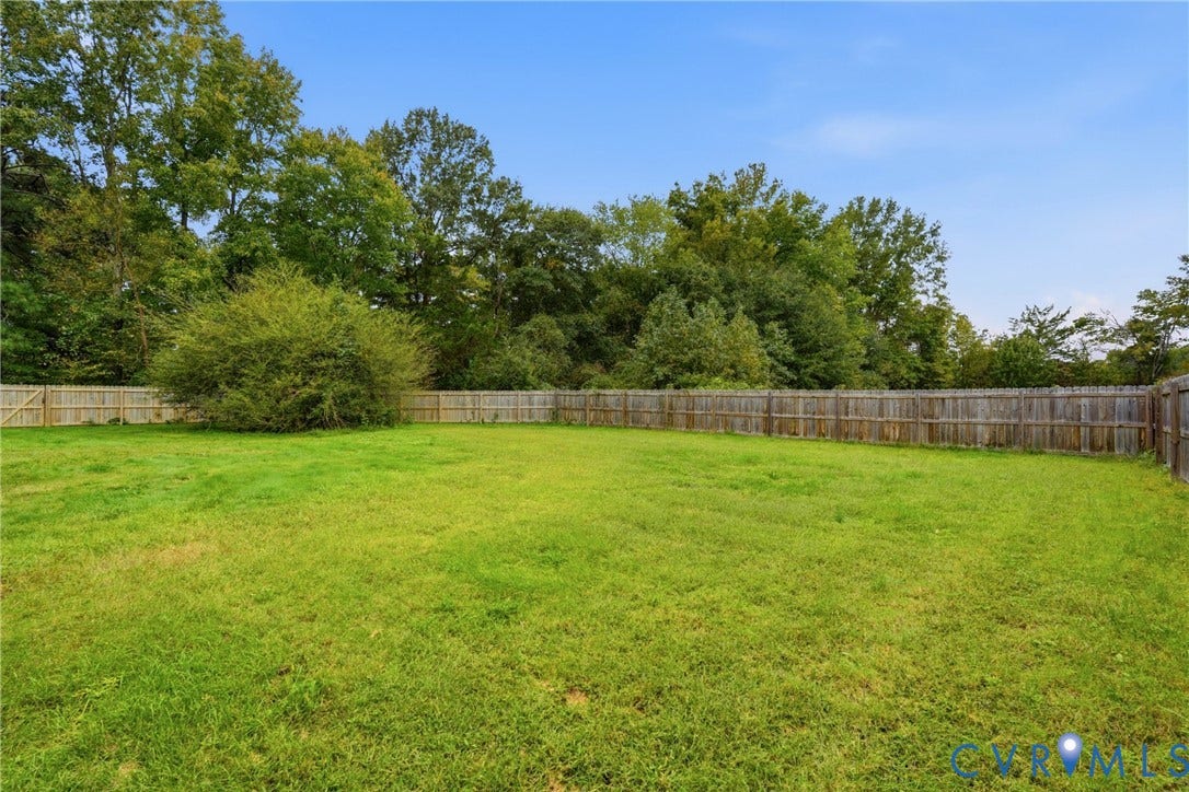 6624 Miller Road, Henrico, VA 23231 Expansive grassy rear yard enclosed by a wood privacy fence