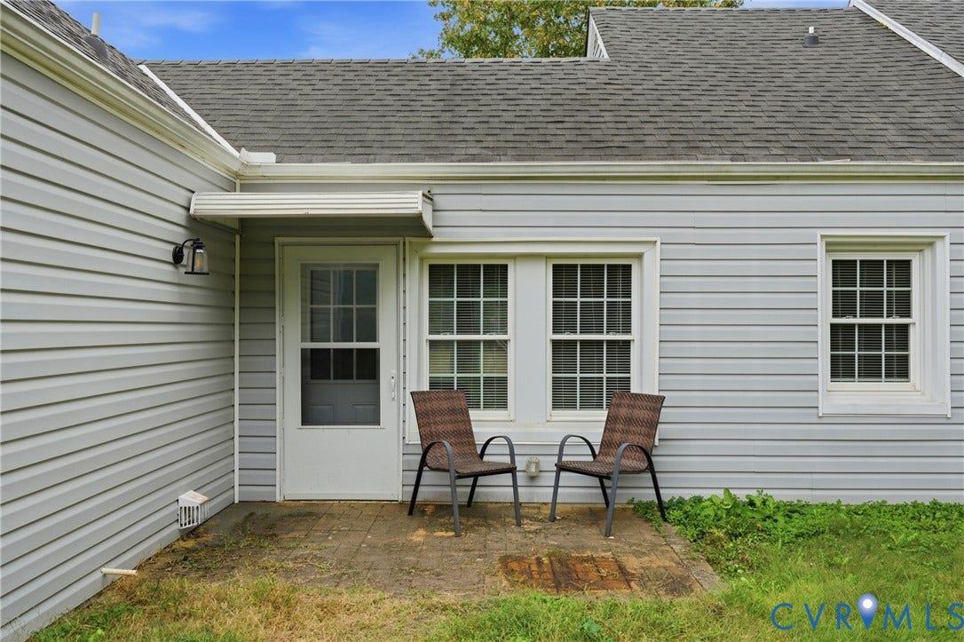 6624 Miller Road, Henrico, VA 23231 Rear patio with French doors, windows opening to a level yard