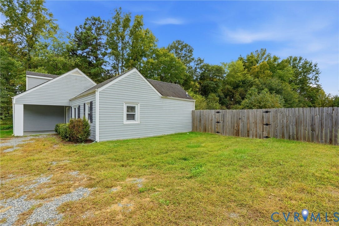 6624 Miller Road, Henrico, VA 23231 wood privacy fencing, and a gravel driveway