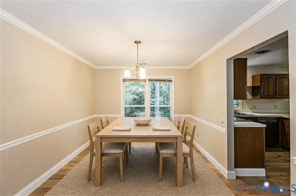 Crown molding and chair rail detailing accent the walls