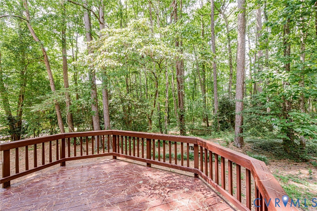 Expansive wood deck with a curved railing
