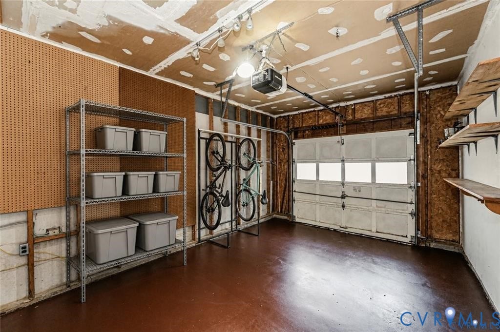 Garage space with a single overhead door, equipped with a garage door opener