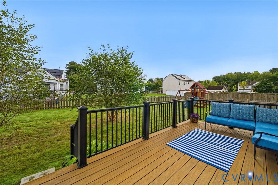 3912 Houze Terrace, Spring Lake, Henrico, VA 23060 Expansive manicured lawn with mature landscaping and established trees, complemented by a detached playground structure