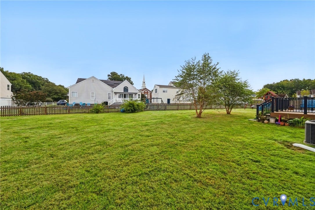 3912 Houze Terrace, Spring Lake, Henrico, VA 23060 Expansive manicured lawn with mature landscaping and established trees, complemented by a detached playground structure