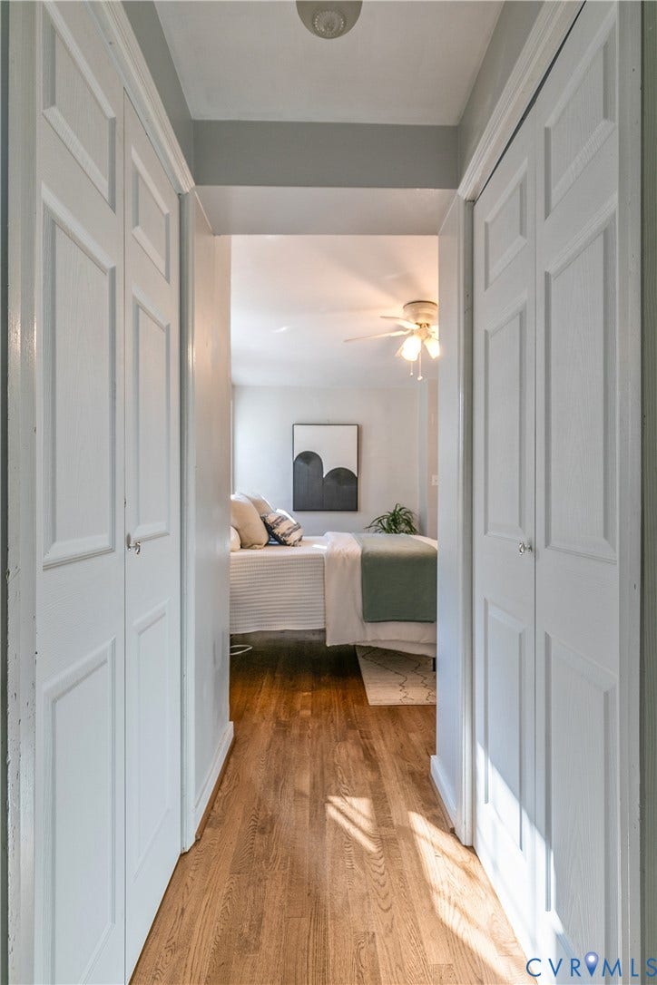 2207 Locbury Lane, Henrico, VA 23228 Hallway featuring wood-finish flooring and dual sets of bi-fold closet doors